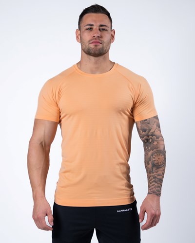 Cheeky Coral Alphalete High Performance Seamless Short Sleeve Tee | 21374-TPXI