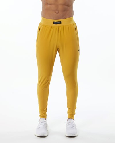 Exotic Yellow Alphalete Woven 4-Way Stretch 29" Pant | 31670-KOMV